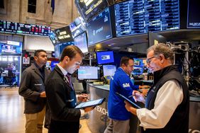 Traders work on the floor of the New York Stock Exchange