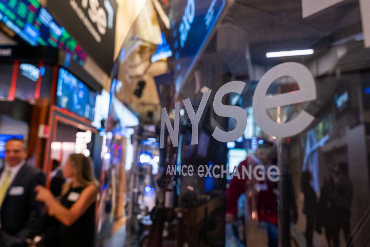 Traders and others work on the New York Stock Exchange (NYSE) floor 