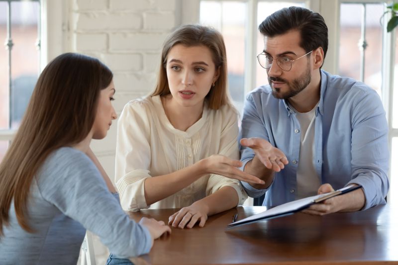 An upset couple push for answers from a financial advisor who misrepresented an investment.