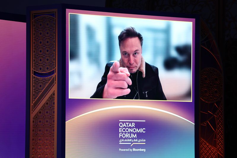 Tesla CEO Elon Musk on screen at the Qatar Economic Forum.