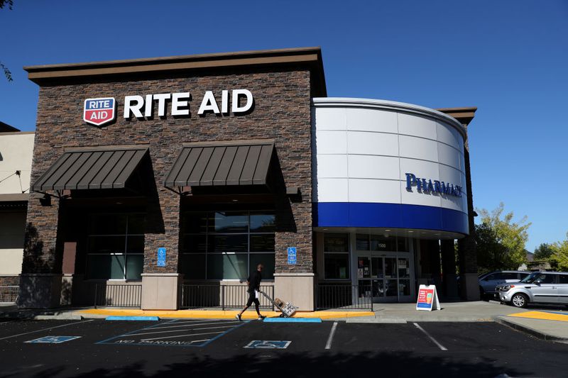 The Rite Aid logo is displayed on the exterior of a Rite Aid pharmacy.