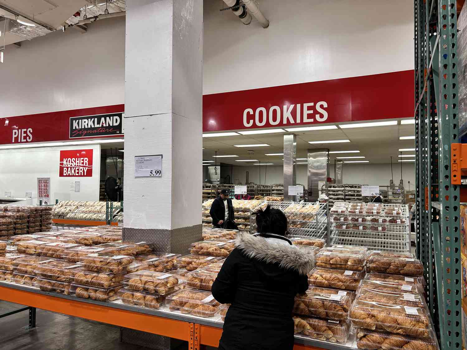 Shoppers look at baked goods at Costco. 