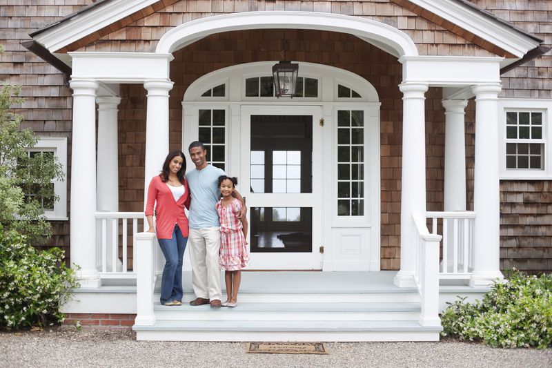 Family in front of home
