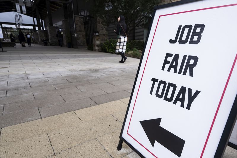 Sign reading "Job Fair Today" outside a building