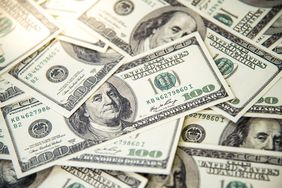 Pile of banknotes of one hundred dollars.