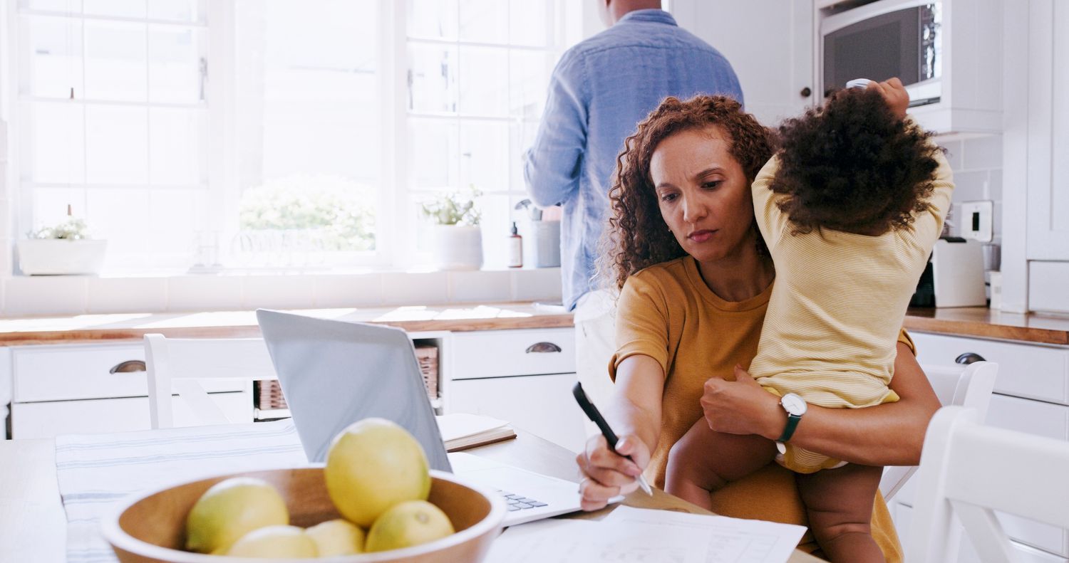 Woman working on her budget in a kitchen