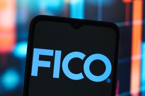 The Fair Isaac and Company (FICO) logo is seen displayed on a smartphone screen