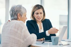 A financial advisor talking to a client.