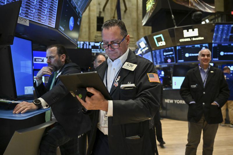Traders work on the floor of the New York Stock Exchange