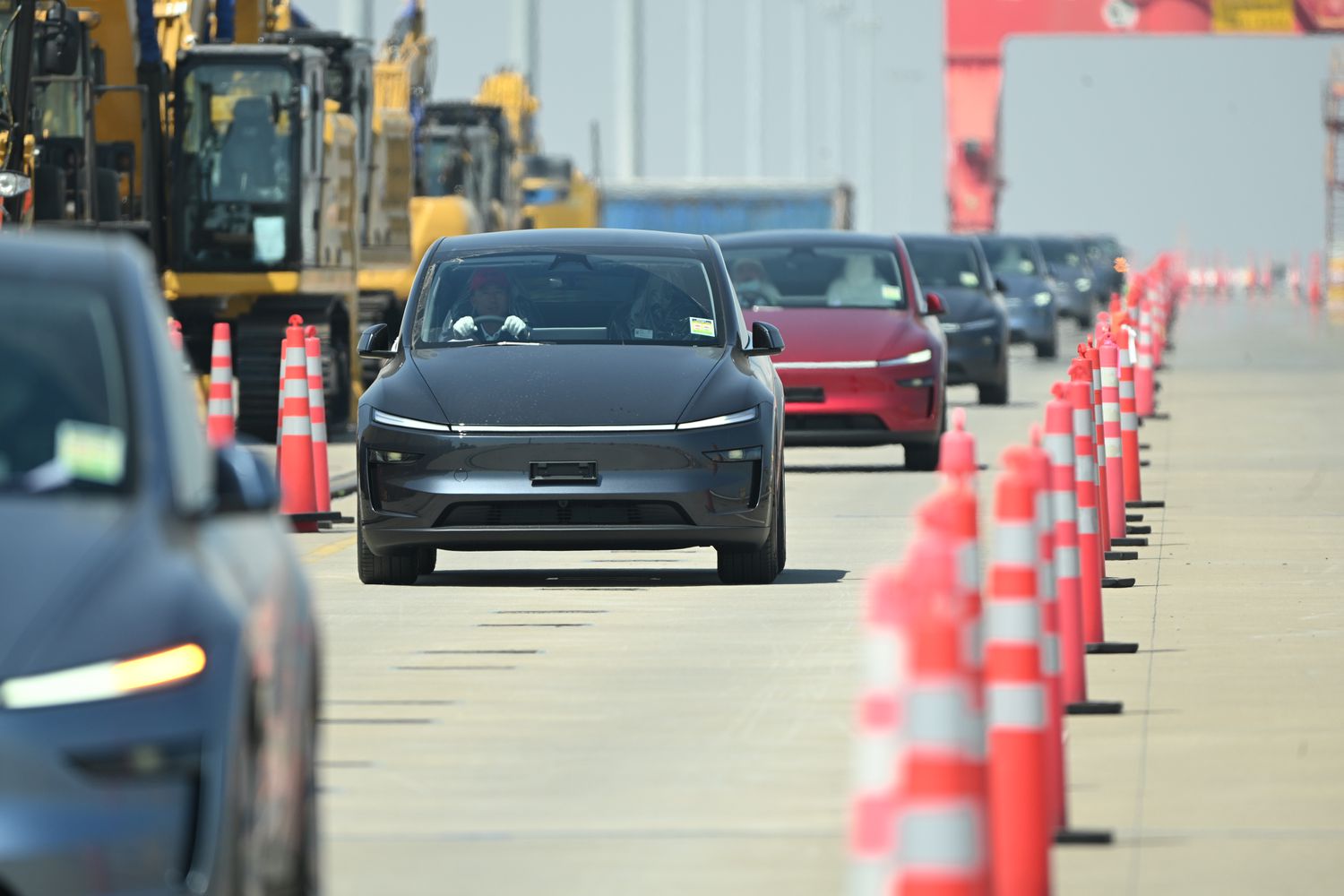 Teslas are driven onto a ship for export from China earlier this month. 