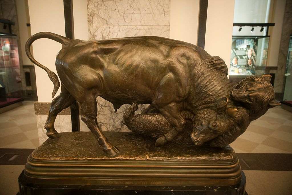 A bronze statue of a bull fighting with a bear on display in the Museum of American Finance on Wall Street in Lower Manhattan in New York.