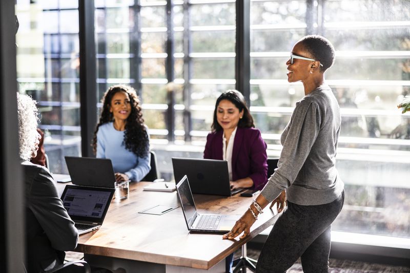 Colleagues talking in a conference room