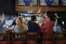 A group of friends watching a football game