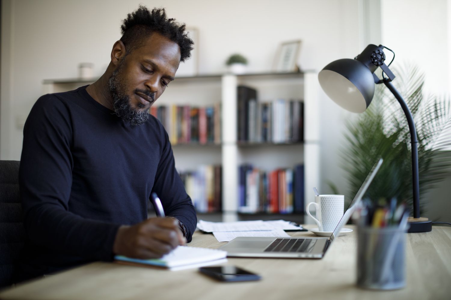 A man studying with his favorite series 7 exam prep course