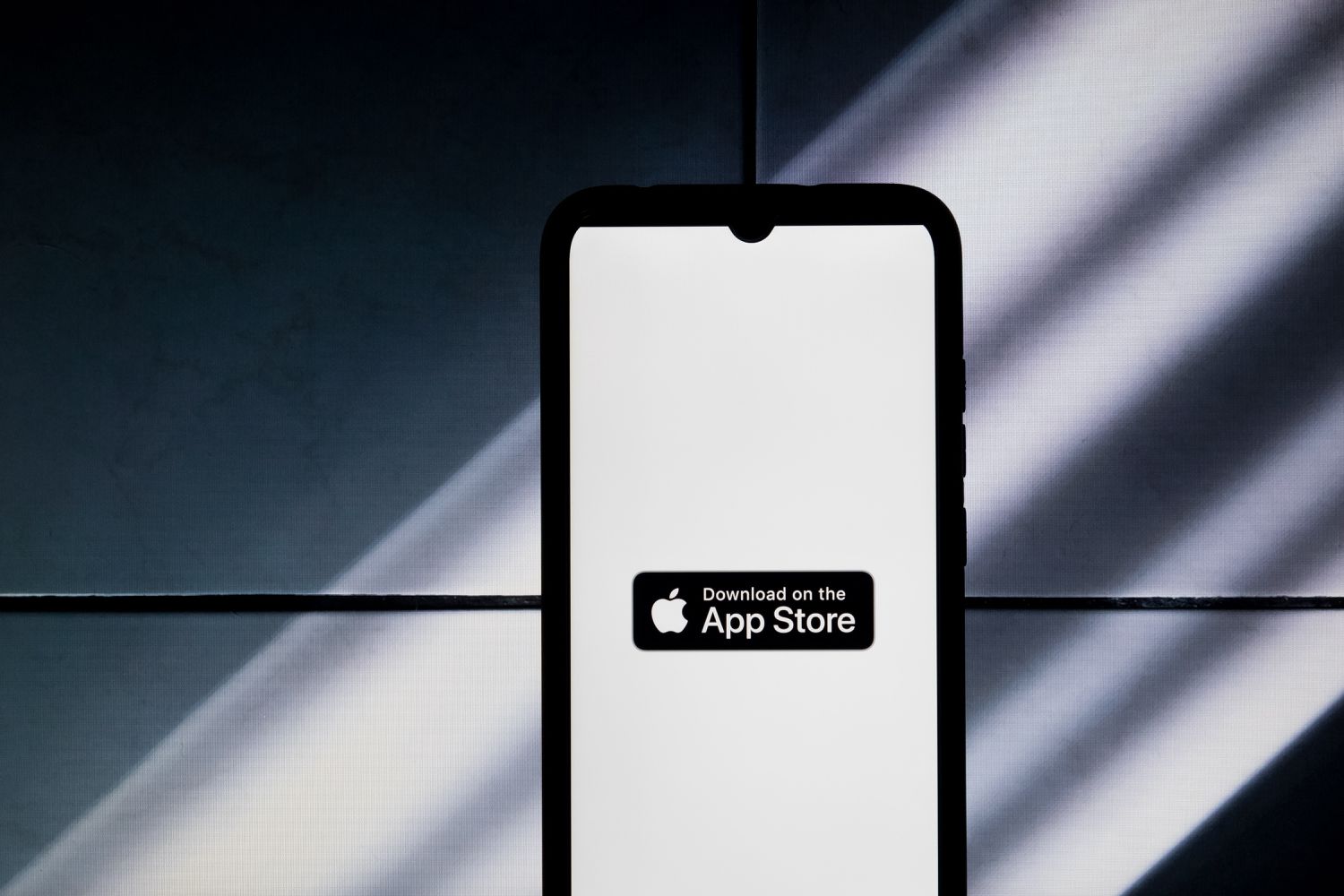 The App Store logo is displayed on a smartphone screen in Athens, Greece, on January 16, 2024. 