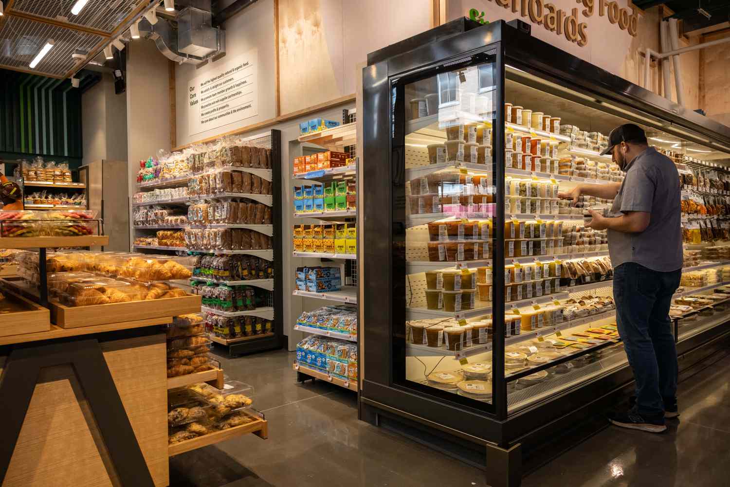A worker prepares products at a Whole Foods Market Daily Shop ahead of opening in the Upper East Side neighborhood of New York, US, on Tuesday, Sept. 17, 2024.