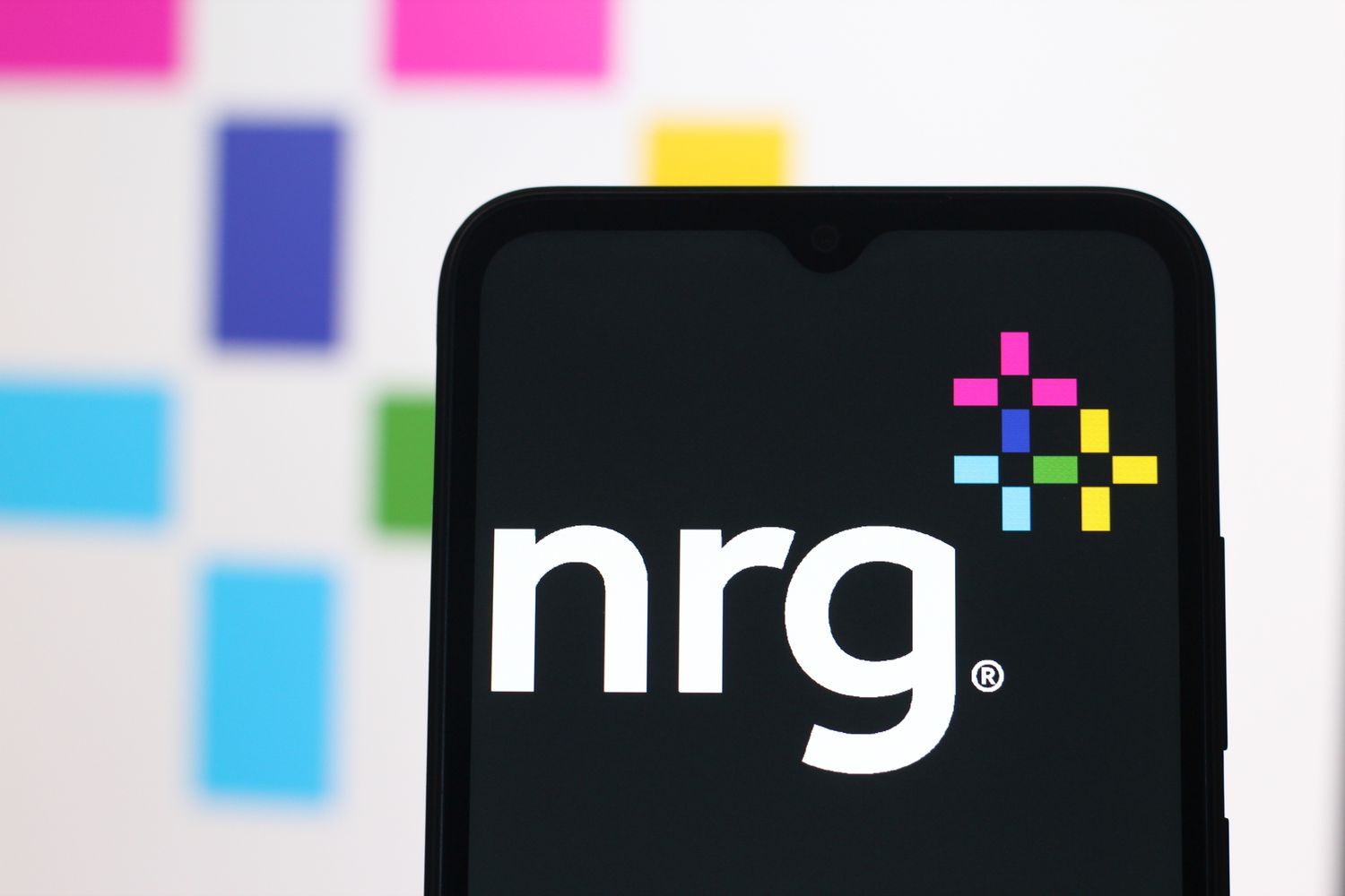 NRG Energy logo displayed on a smartphone screen.