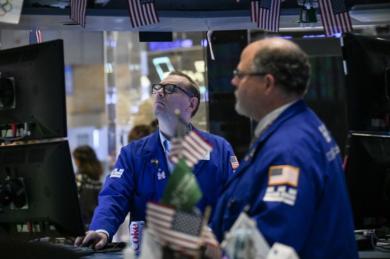 Traders work on the floor of the New York Stock Exchange