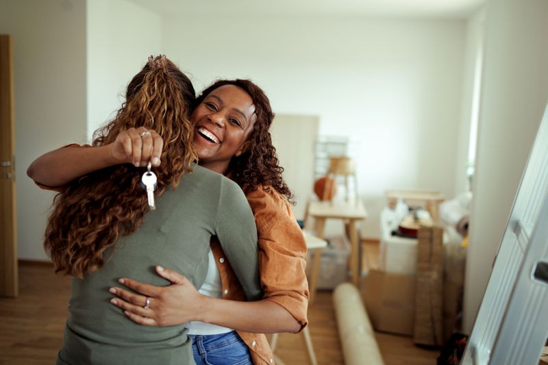 A couple with a key to their new home
