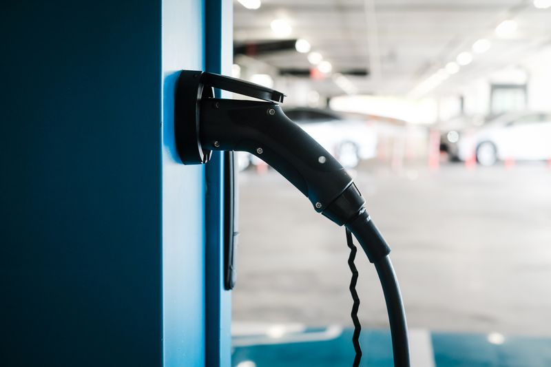 Charging an electric car battery, new innovative technology EV electrical vehicle