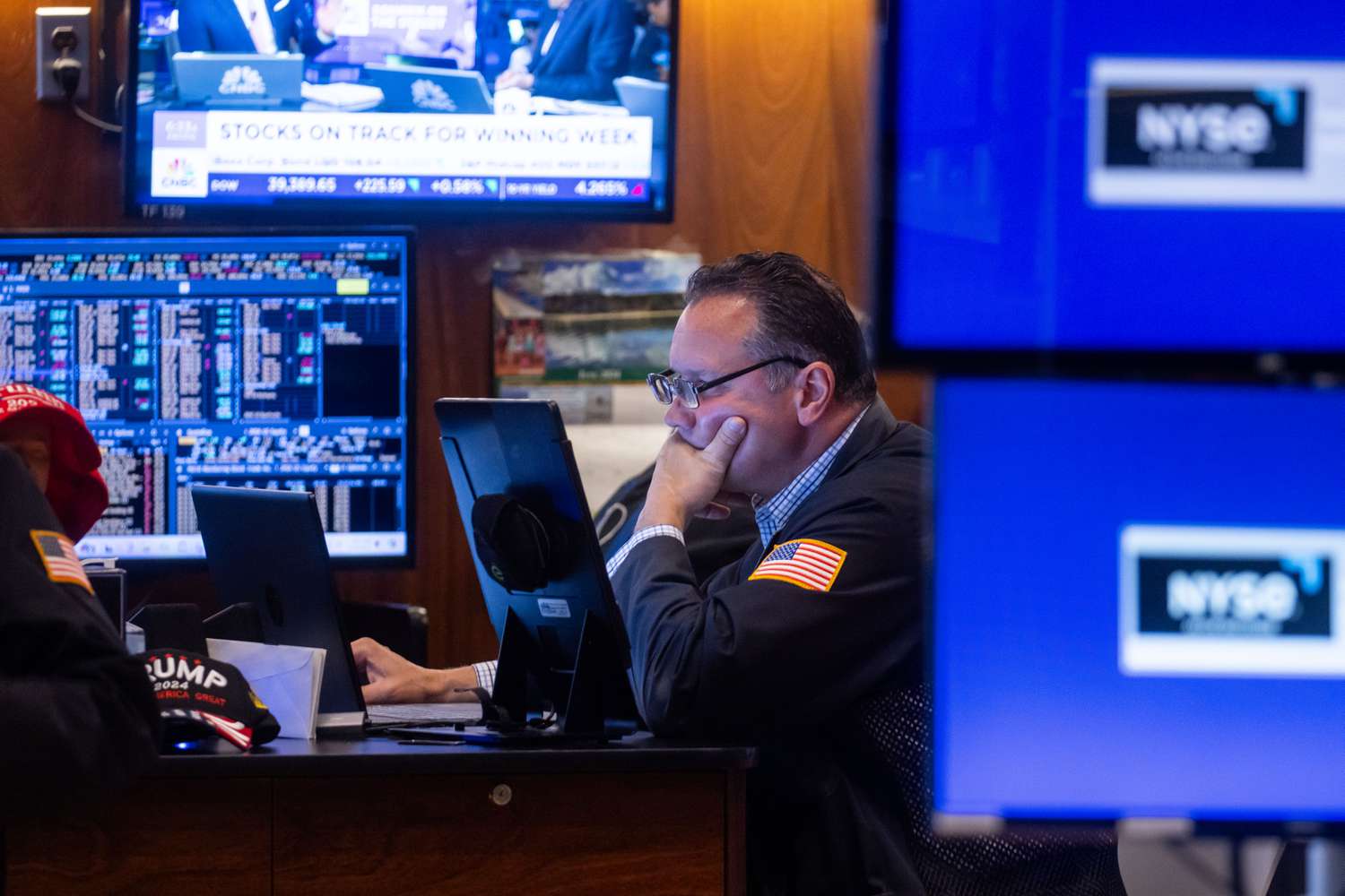 Trader on the floor of an exchange looking at market data