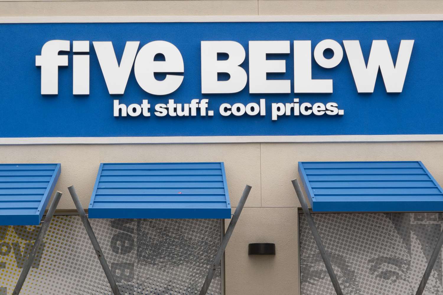 The Five Below corporate logo is displayed on a sign at their outlet store on January 31, 2025 in San Diego, California