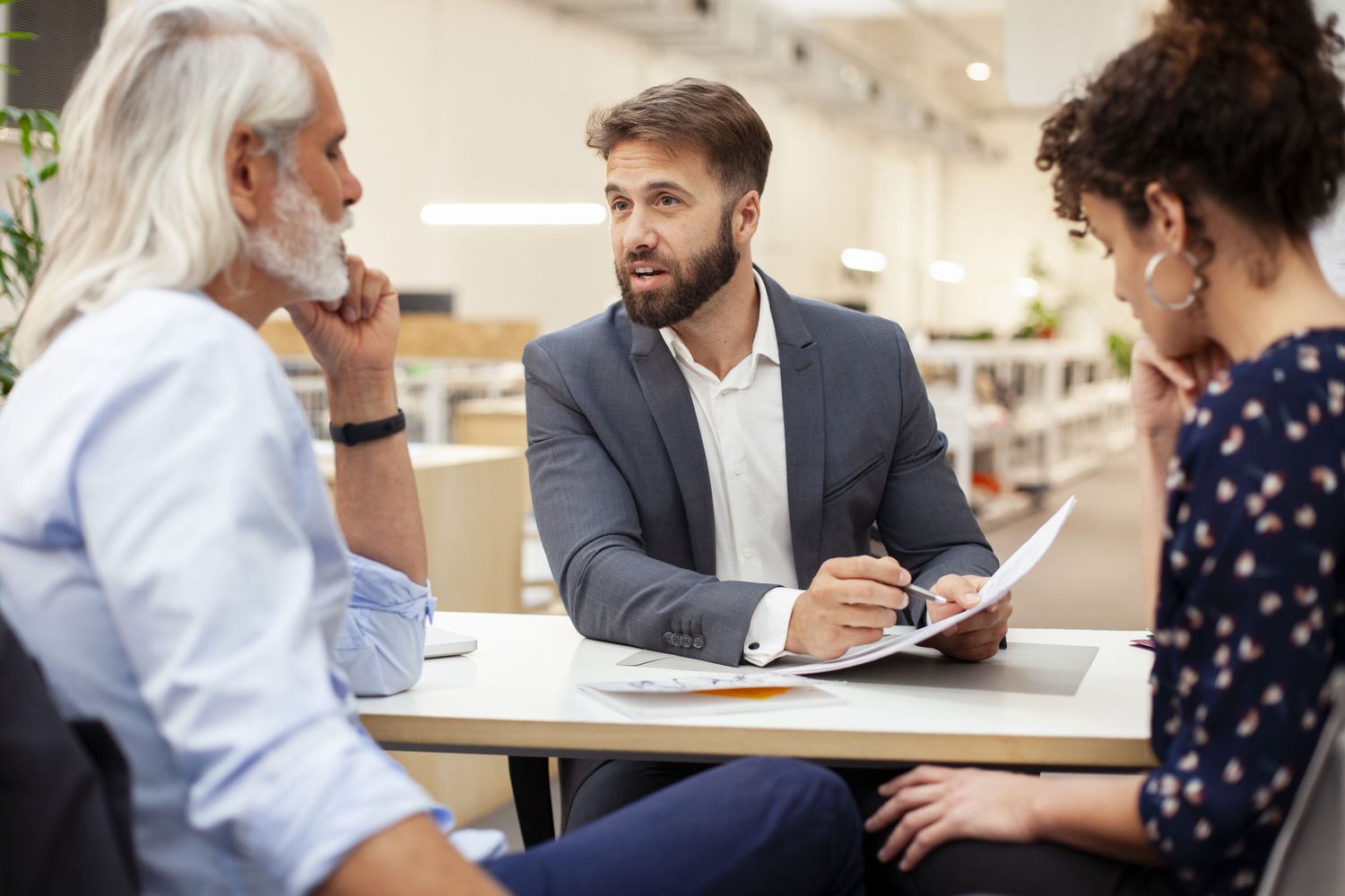 A couple in a meeting with a bank employee at one of the banks in The Federal Home Loan Bank (FHLB) System for their mortgage loan.