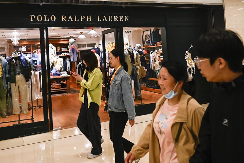 People walk past a Polo Ralph Lauren store in Beijing on May 8, 2025