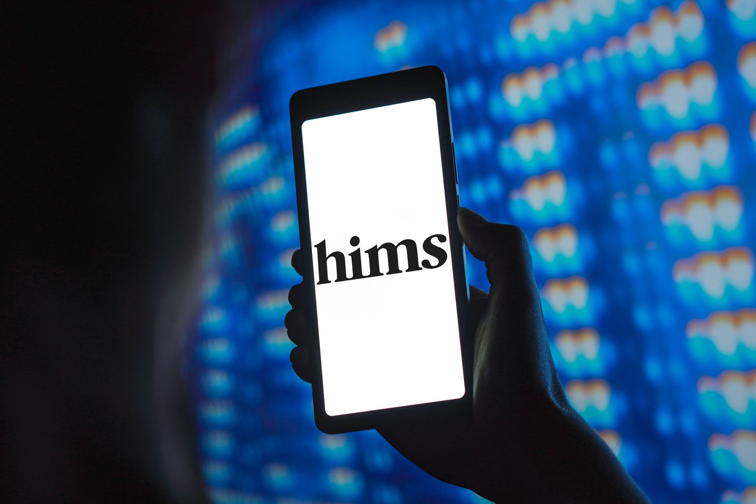 Hims & Hers Health logo shown on a smartphone