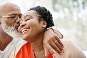 Shot of a mature man affectionately kissing his wife at home