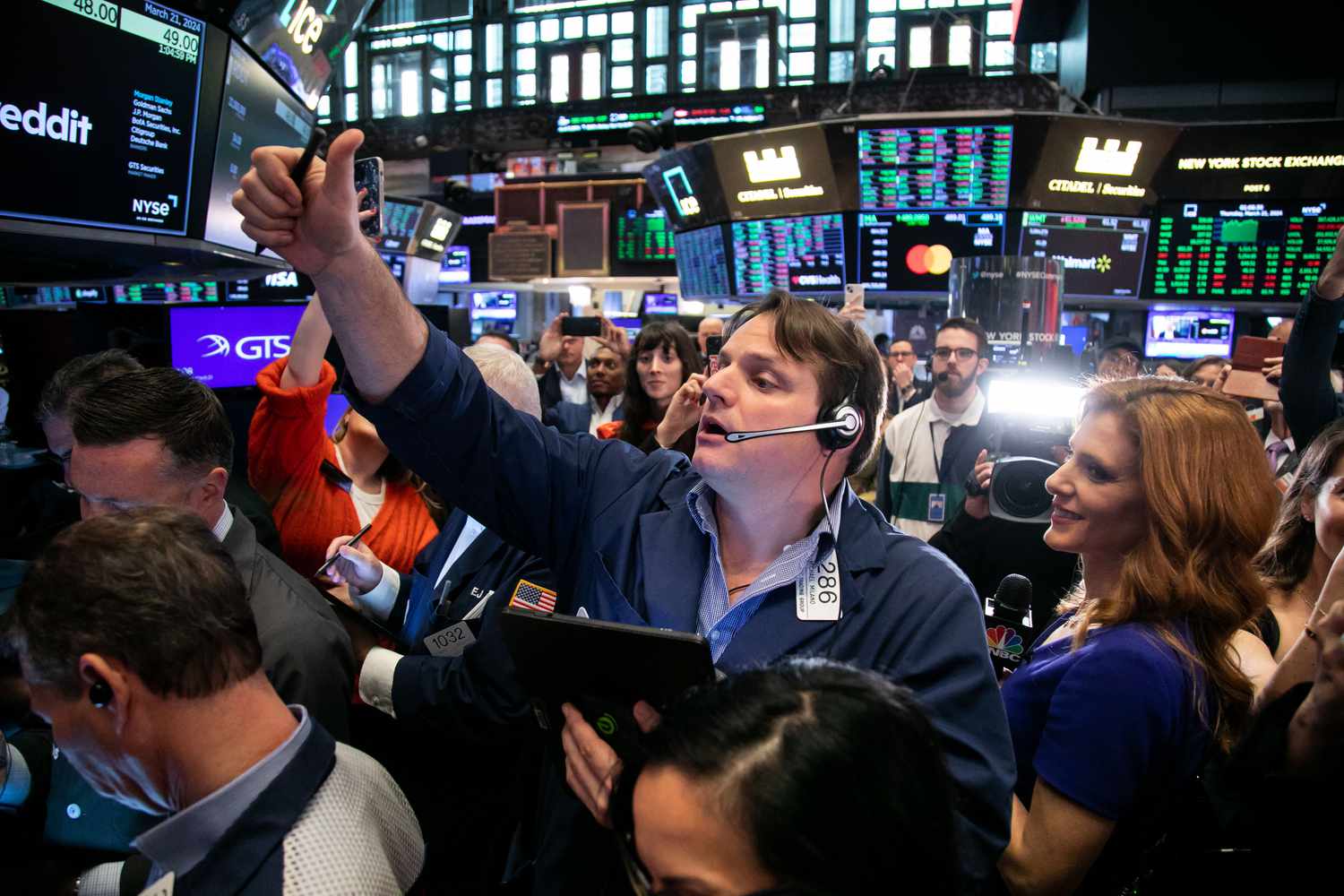Traders work during the Reddit Inc. initial public offering (IPO) on the floor of the New York Stock Exchange.