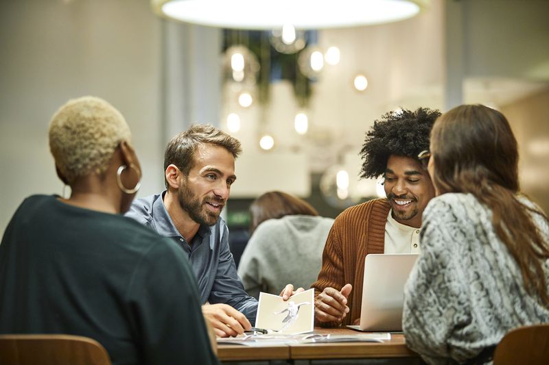Multi-Ethnic Coworkers Discussing in Office
