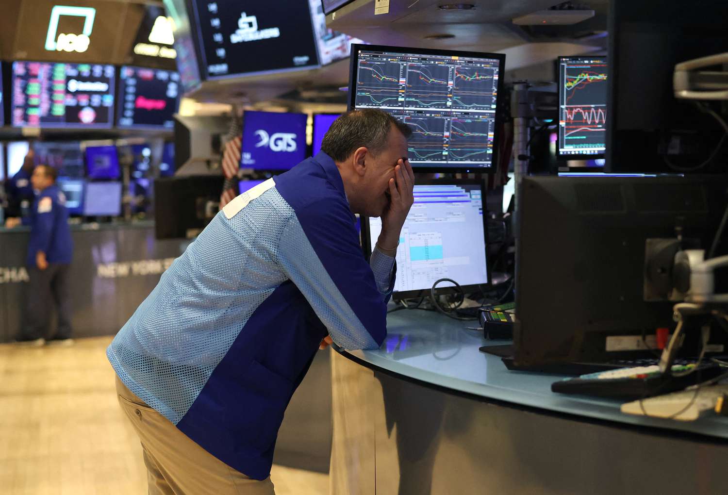 Traders work on the floor of the New York Stock Exchange