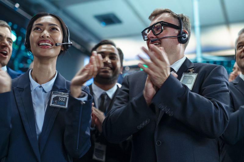 Group of Successful Stock Exchange Brokers Celebrating a Profitable Investment Bid on a Securities Market.