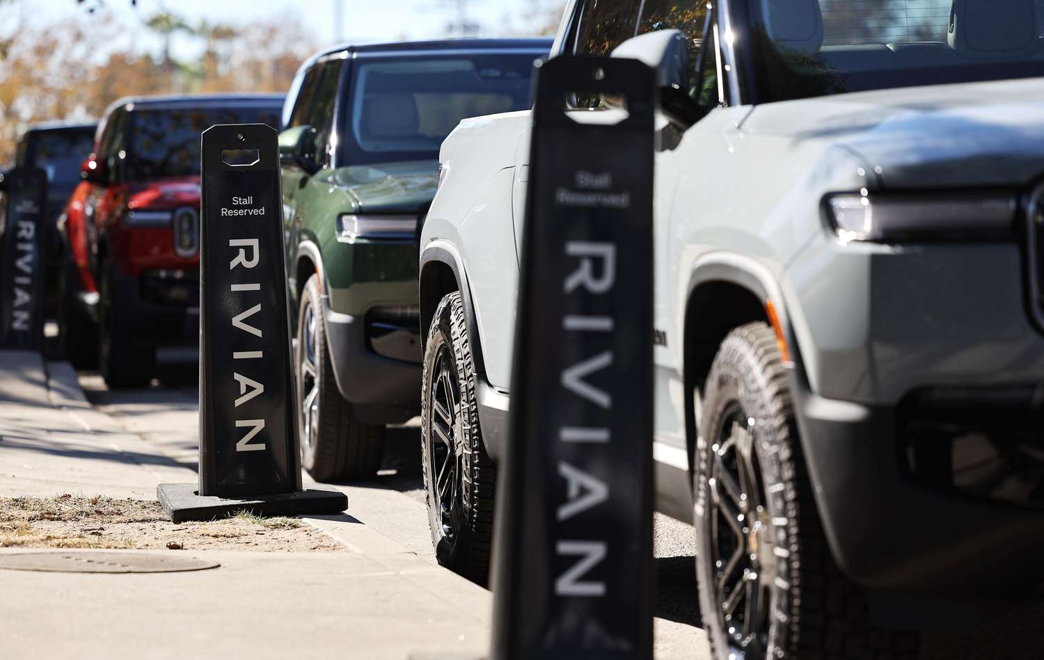 Rivian electric vehicles (EV) are parked at the Rivian Venice Hub on Nov. 13, 2024 in Venice, Calif.
