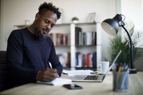 A man studying with his favorite series 7 exam prep course