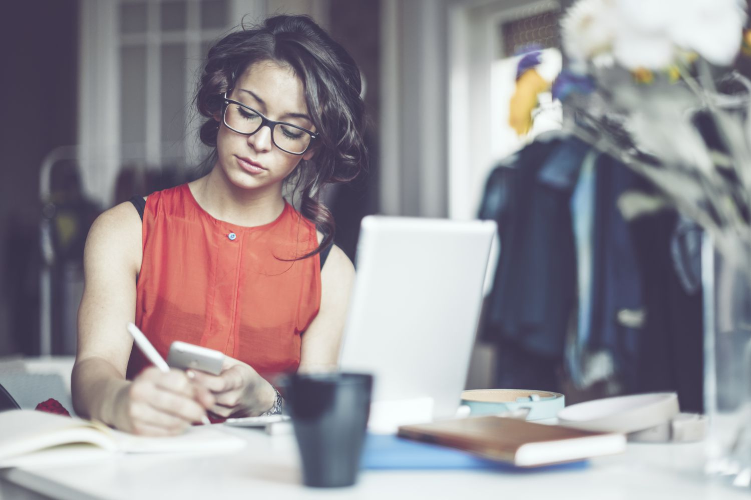 A woman opens a new bank account from home.