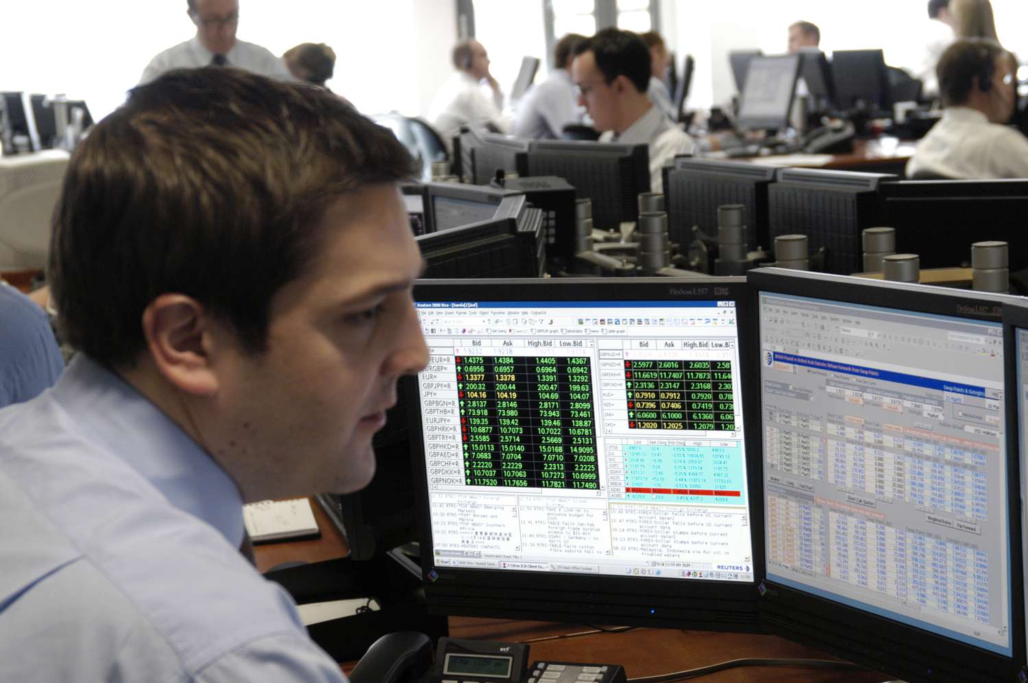 Investor looking at his positions on a computer monitor