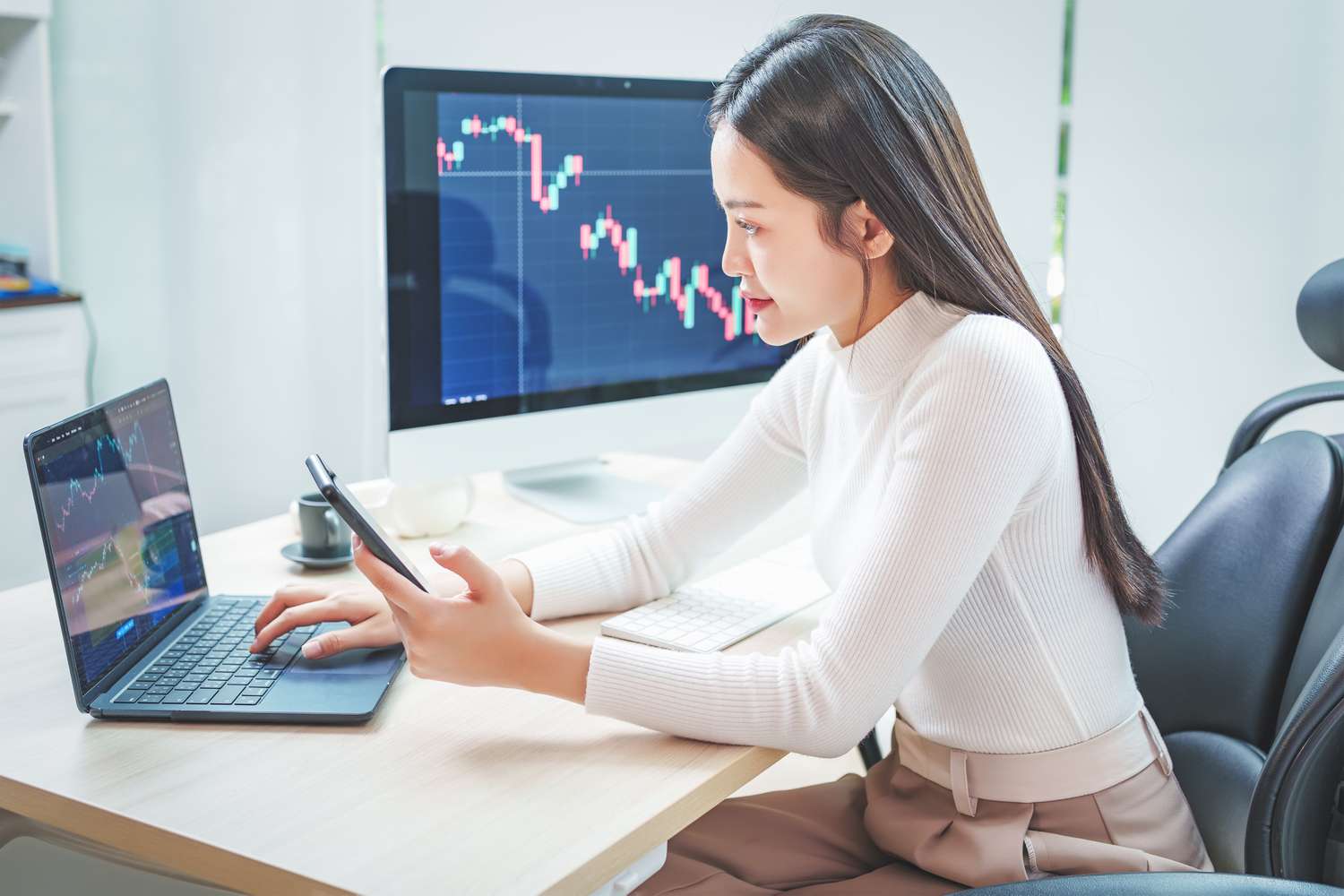 Young trader using smartphone to monitor cryptocurrency prices for Bitcoin IRA investment.