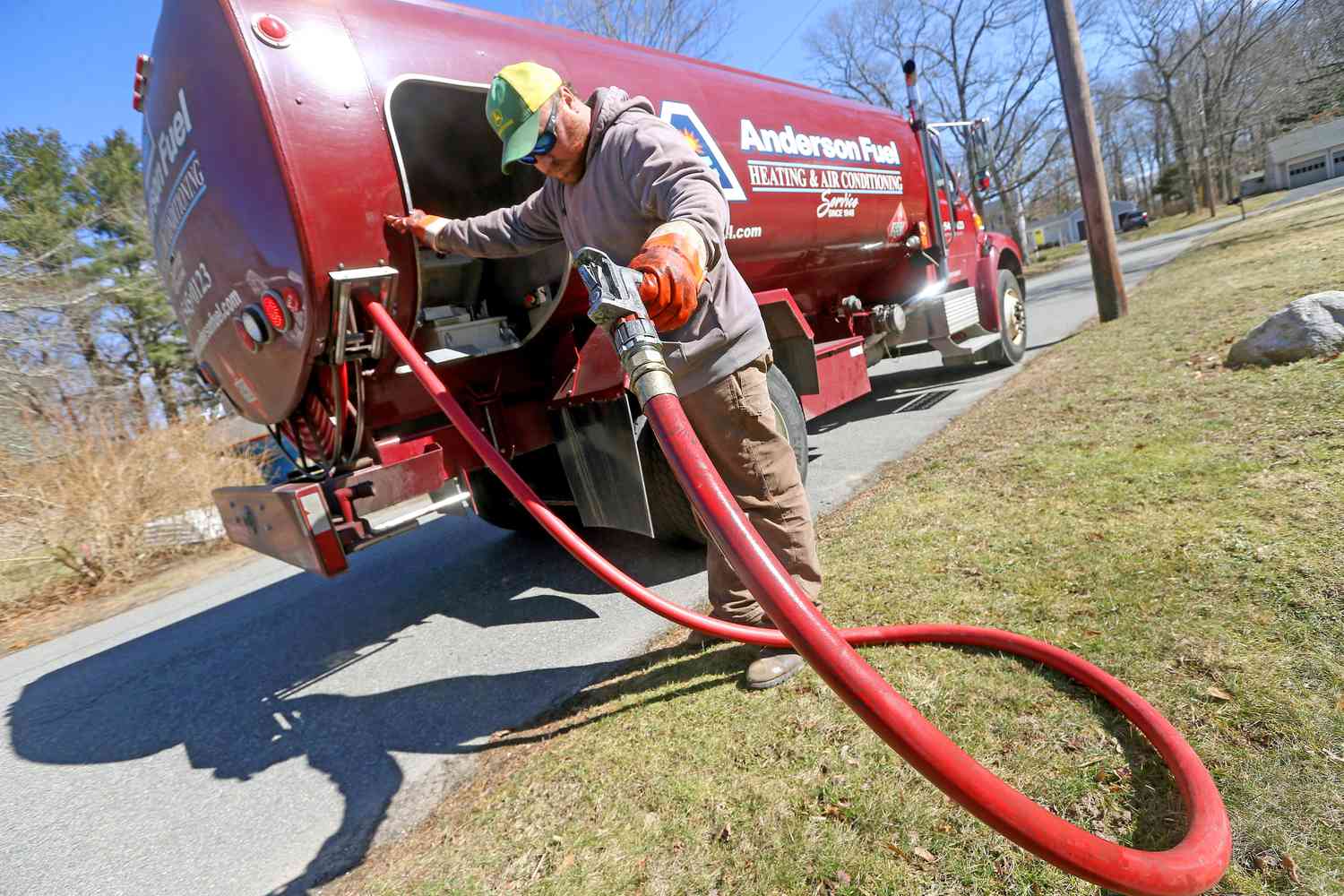 Corey Carlson of Anderson Fuel after filling a house with home heating oil on March 8, 2022 in Scituate, Massachusetts.