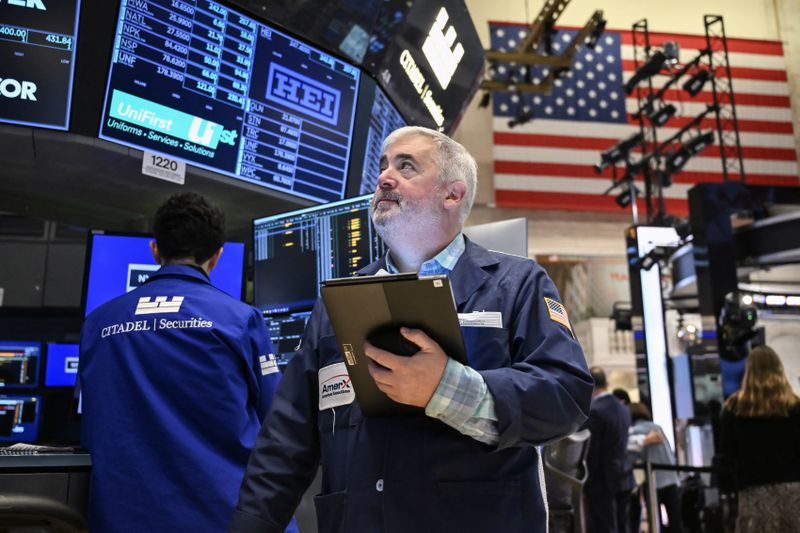 Traders work on the floor of the New York Stock Exchange
