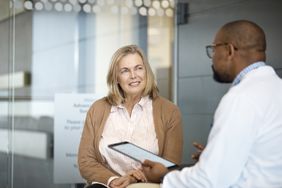 A woman has a discussion with a doctor.