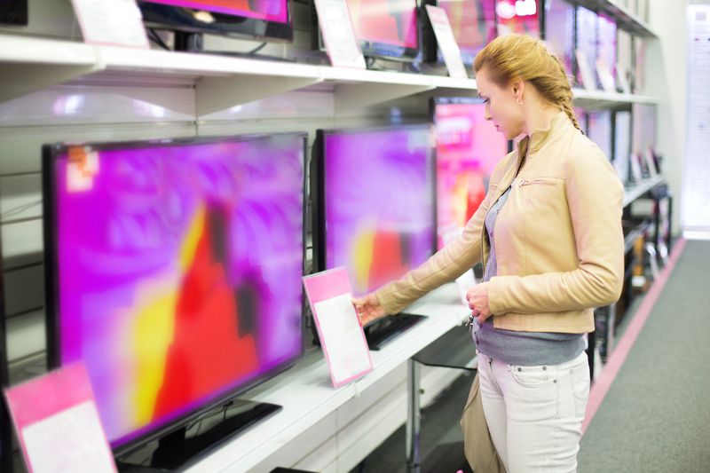 Woman buying a TV