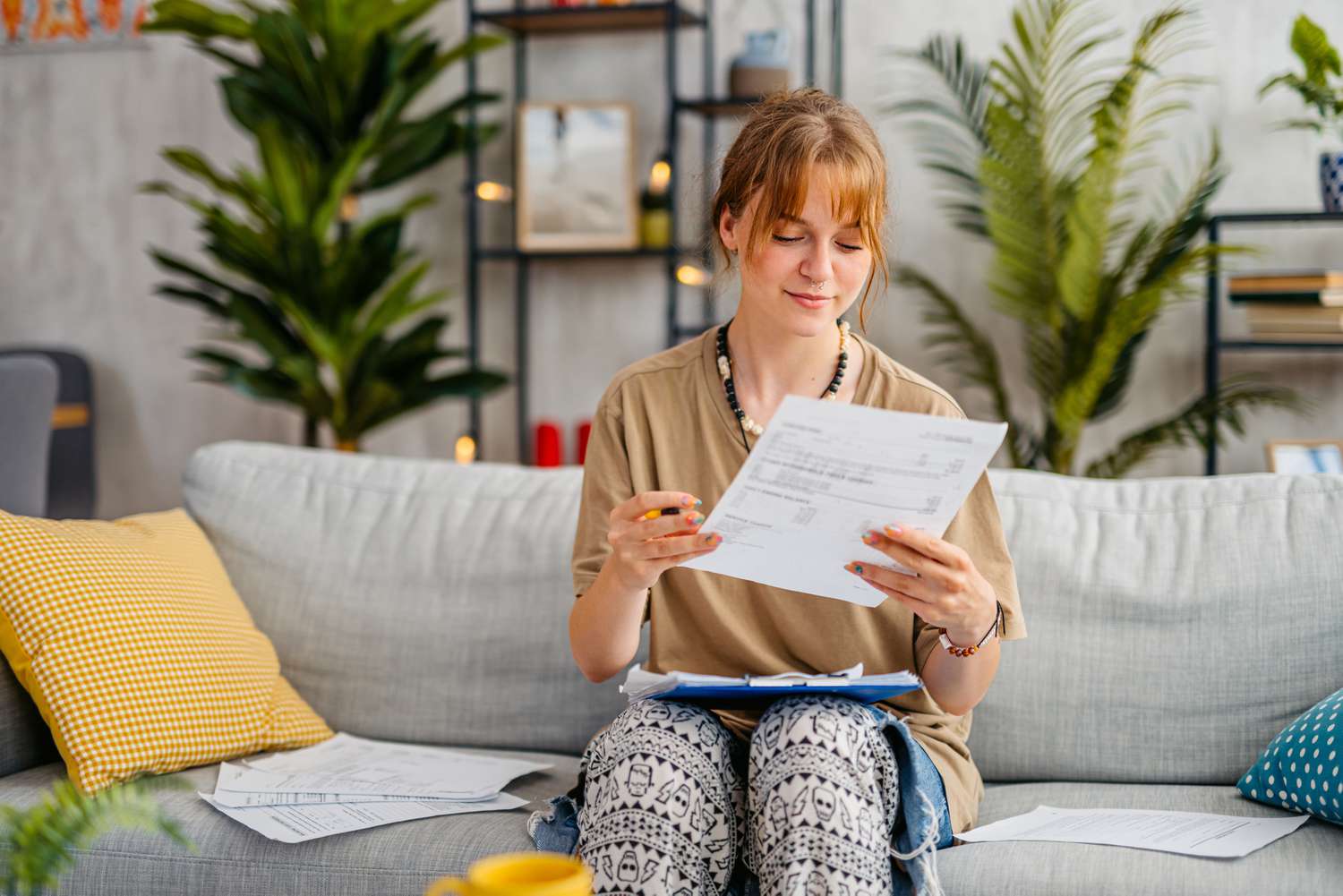 A woman with a satisfied expression reviewing documents