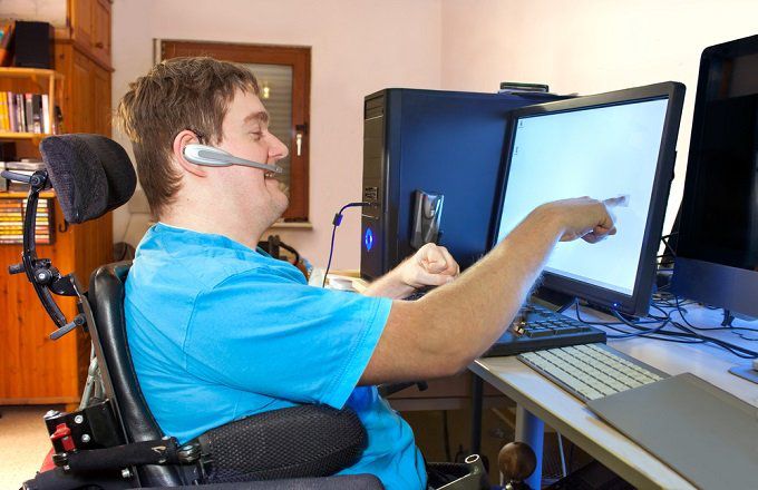 Man with disabilities at computer