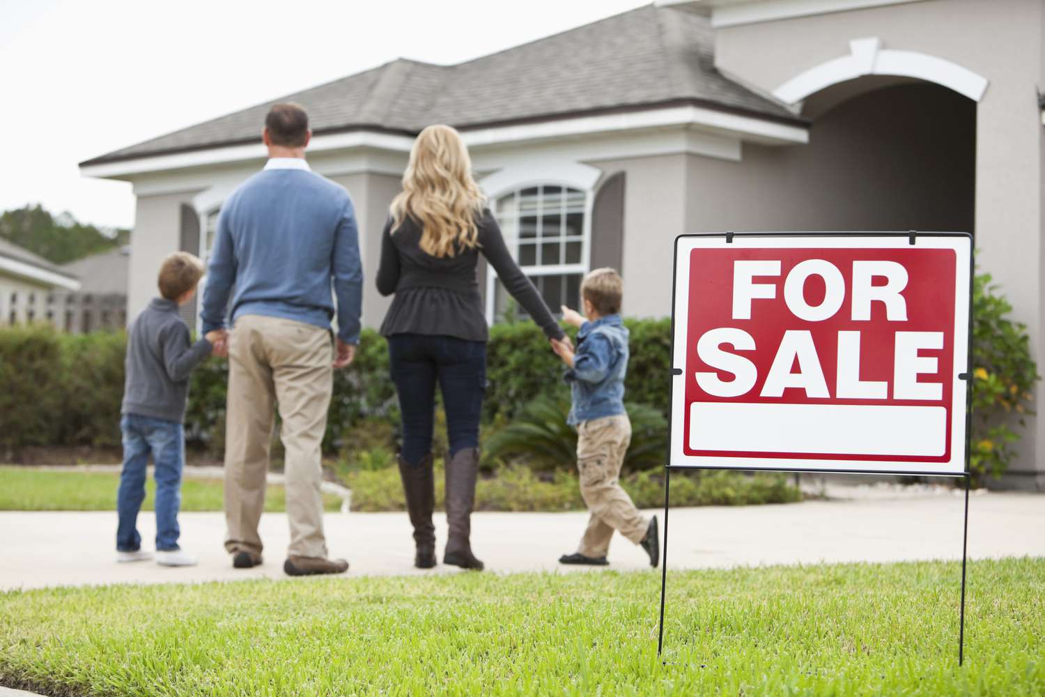 Family looking at house for sale