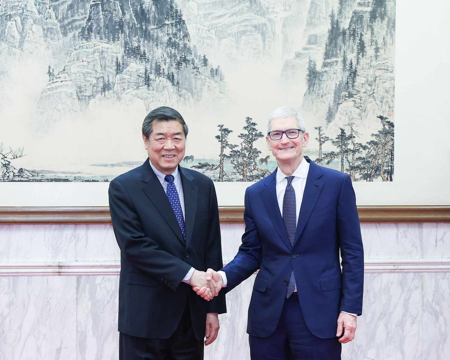 Chinese Vice Premier He Lifeng, also a member of the Political Bureau of the Communist Party of China Central Committee, meets with Apple CEO Tim Cook in Beijing, capital of China, March 23, 2025.