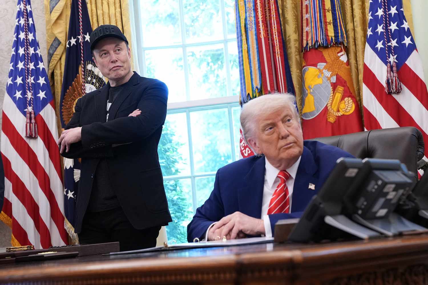 President Donald Trump and Tesla CEO Elon Musk are seen in the Oval Office of the White House.