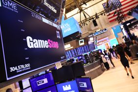 The Gamestop company logo is displayed on a screen as traders work on the floor of the New York Stock Exchange during morning trading on March 22, 2023 in New York City. 