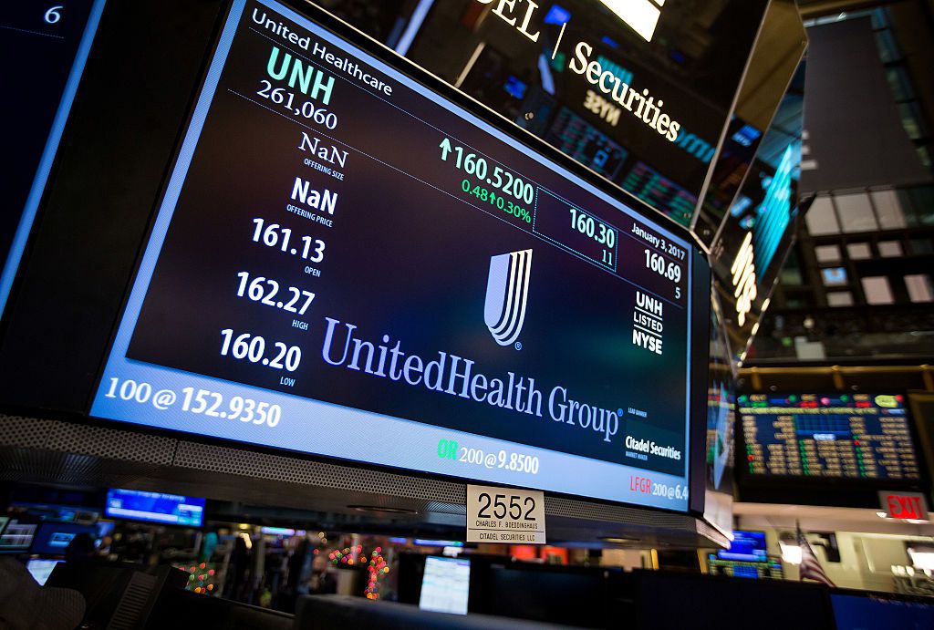 UnitedHealth Group Inc. signage is displayed on a monitor on the floor of the New York Stock Exchange (NYSE) in New York, U.S., on Tuesday, Jan. 3, 2017. 